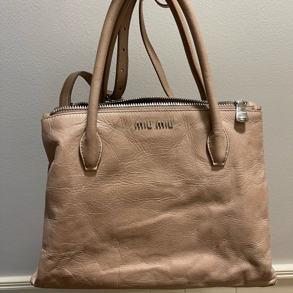 Miu Miu tan/beige authentic - from the Las Vegas store.